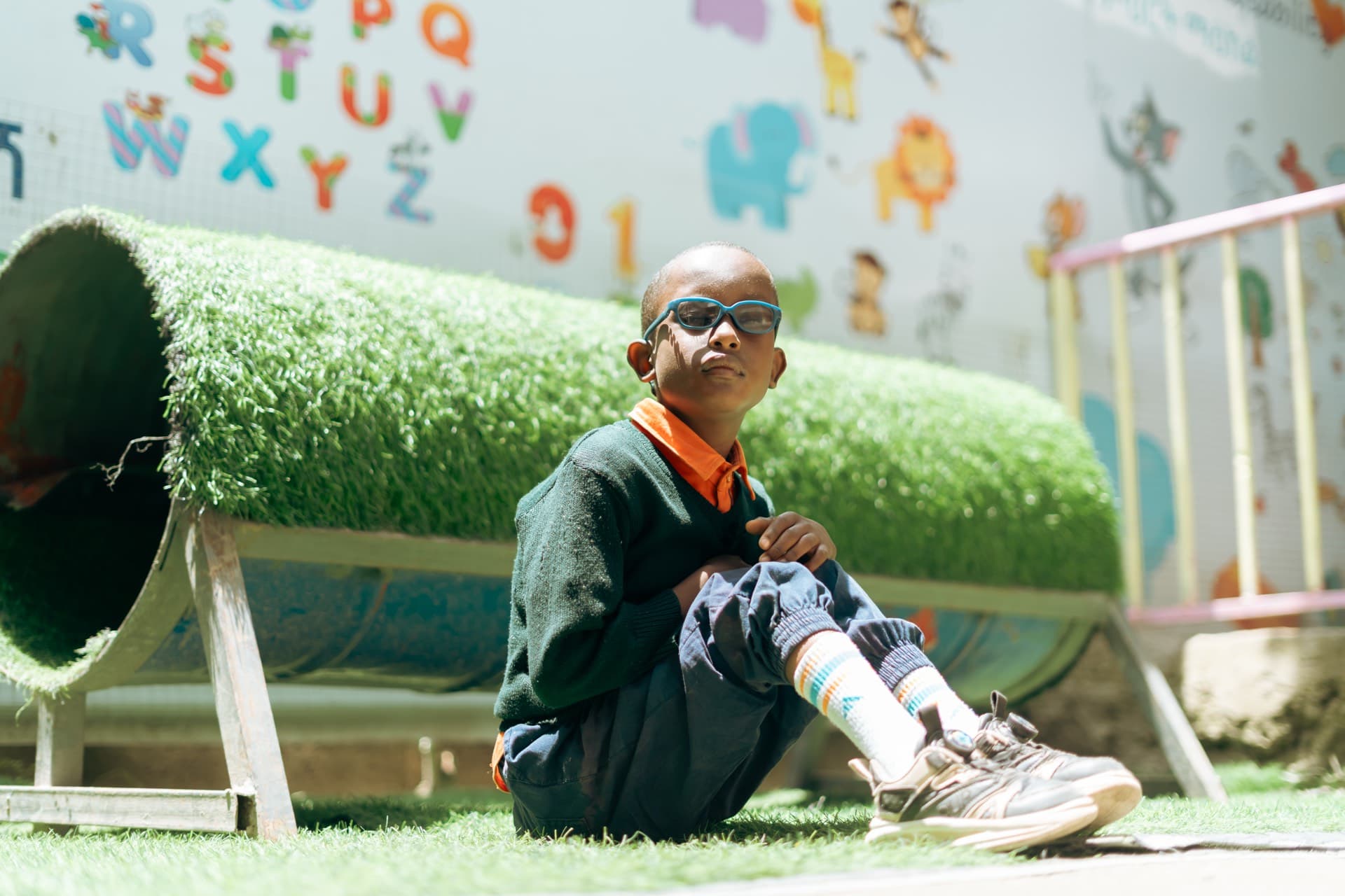 Boy sitting and looking thoughtful