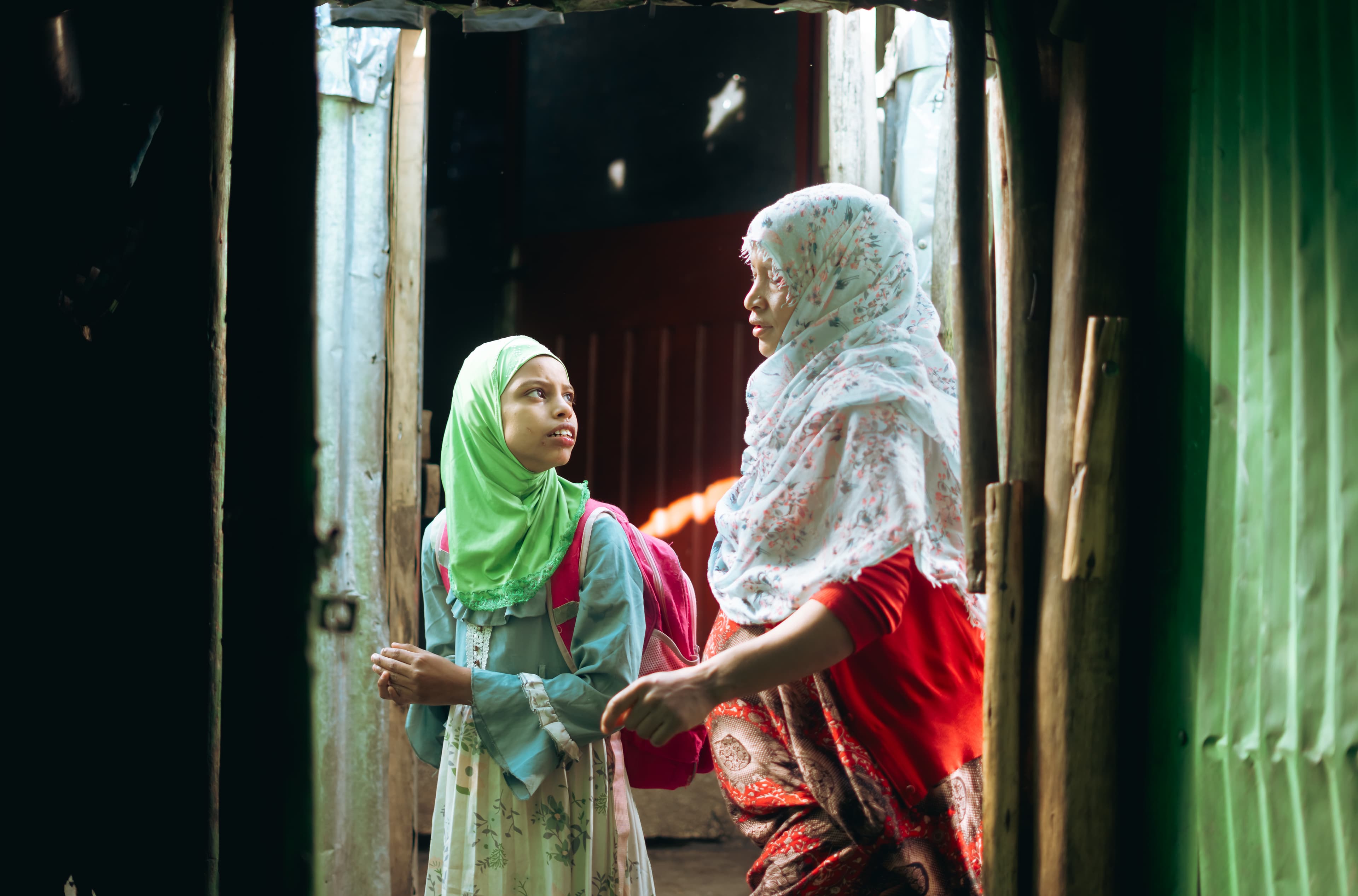 Mother dropping off her daughter at the center